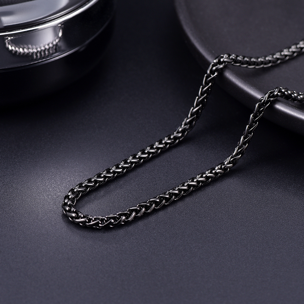 Black stainless steel wheat chain on dark background