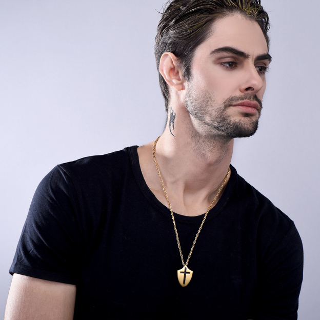 Gold Shield Cross Necklace on Man in Black T-Shirt | Religious Christian Jewelry