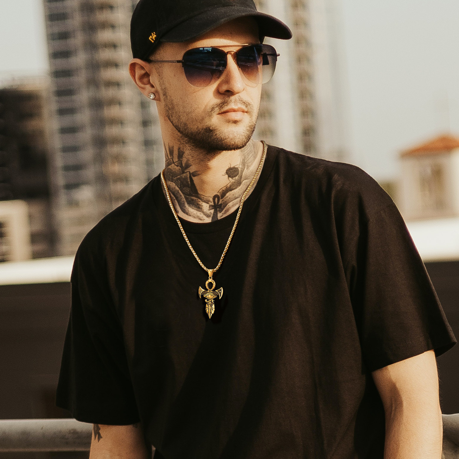 Gold ankh cross pendant necklace worn by model