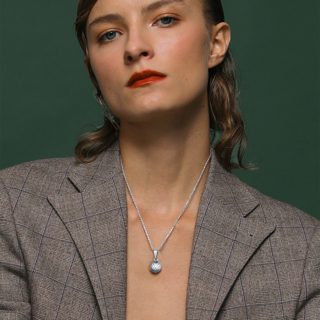 Woman wearing STEEL volleyball pendant necklace elegant look