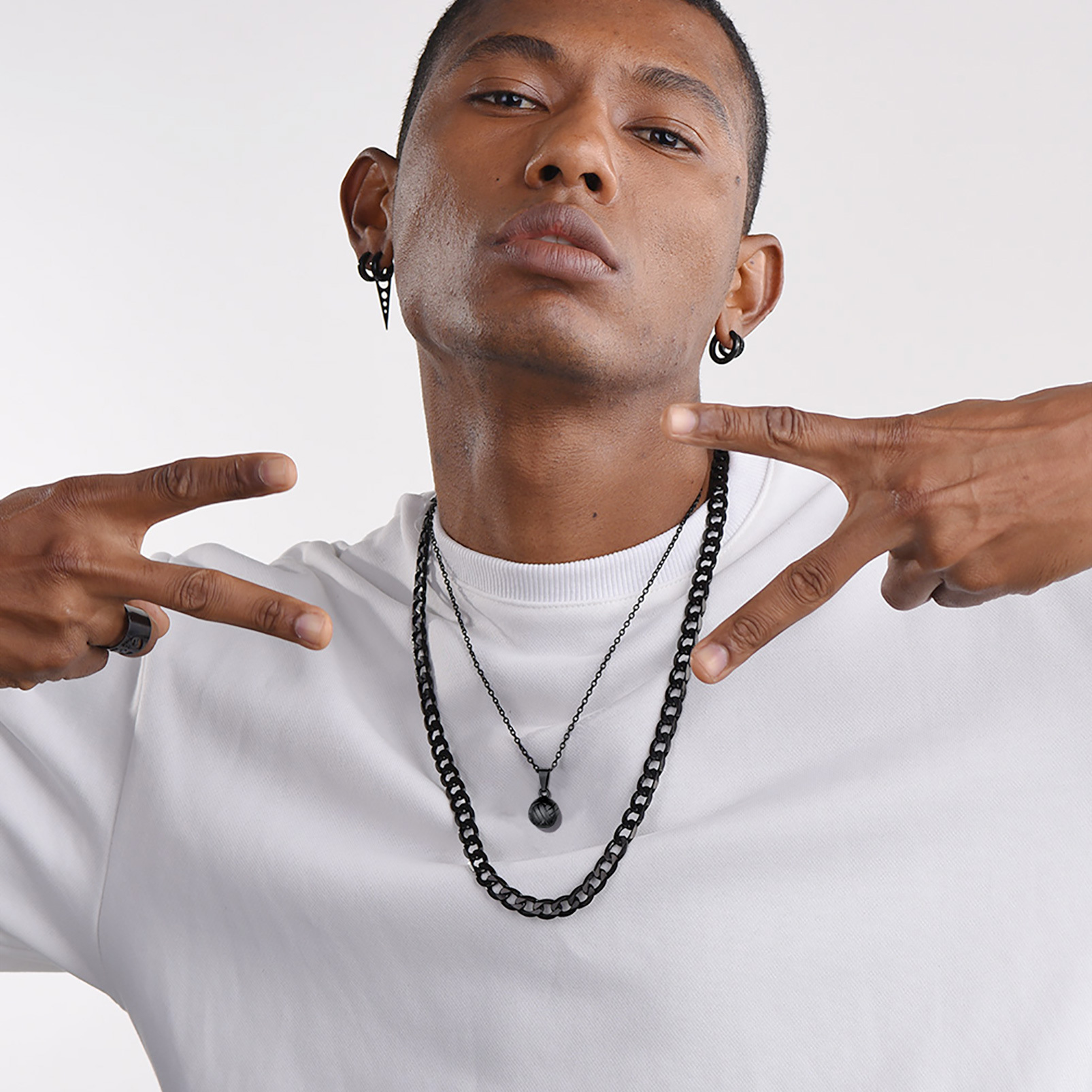 Man wearing volleyball pendant necklace everyday outfit