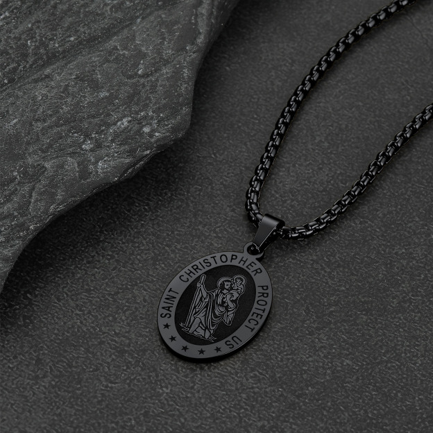 Black Saint Christopher necklace on black stone background