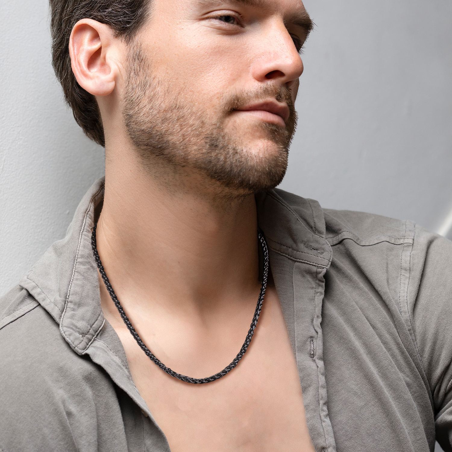 Men wearing black wheat chain necklace