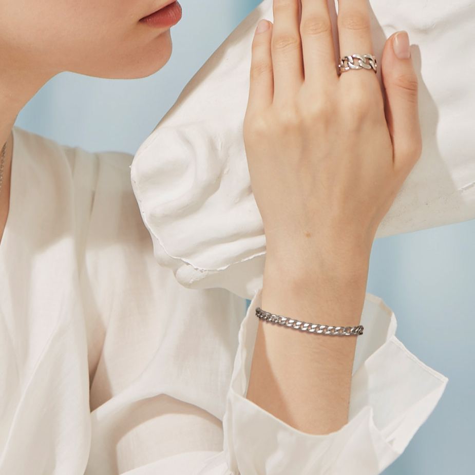 cuban bracelet on wrist, minimalist style