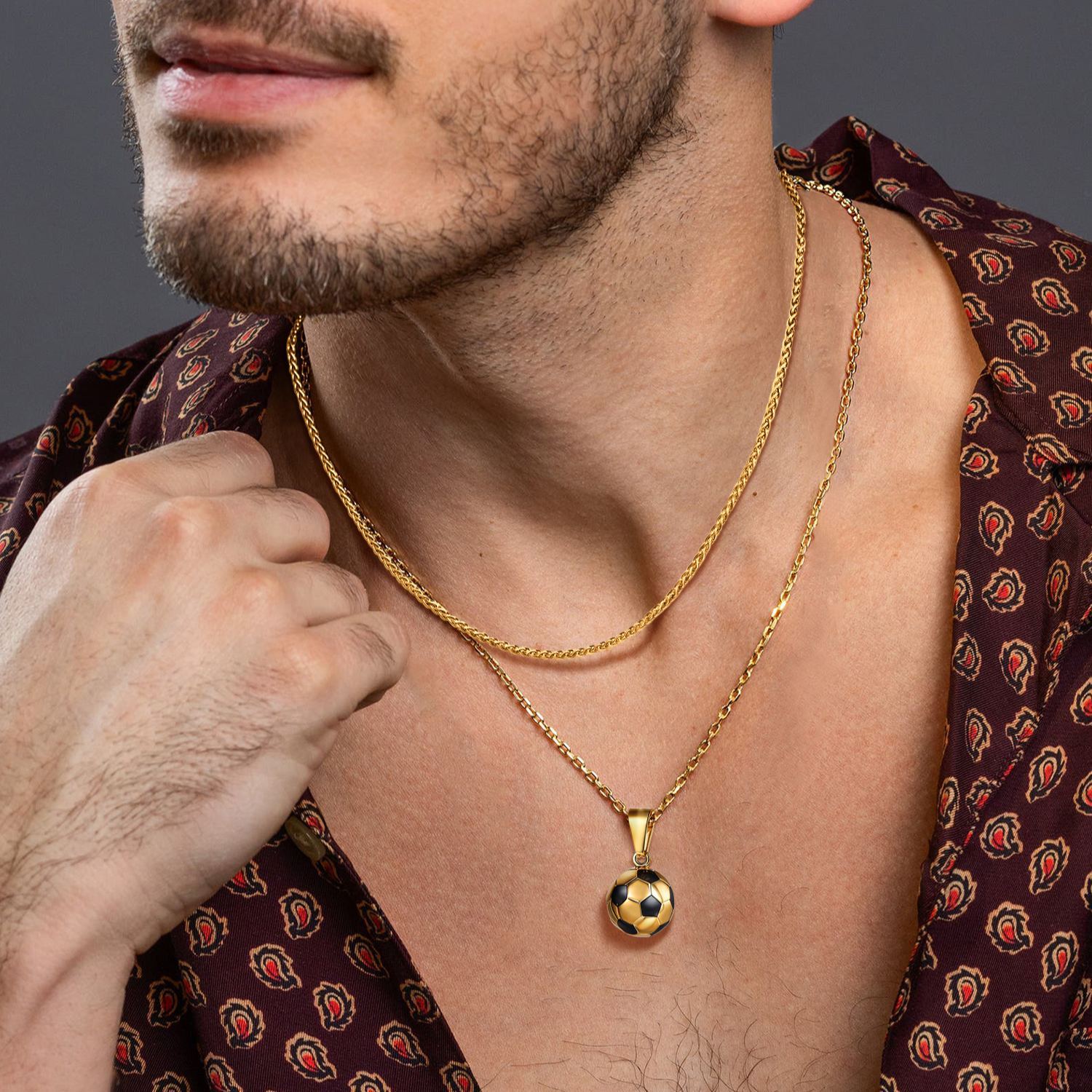 Gold wheat chain necklace layered with pendant