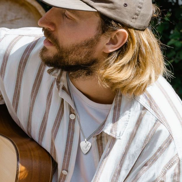 Man wearing PROSTEEL stainless steel guitar pick necklace
