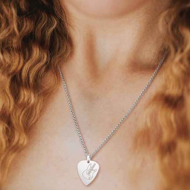 Woman with curly hair wearing silver guitar pick necklace 