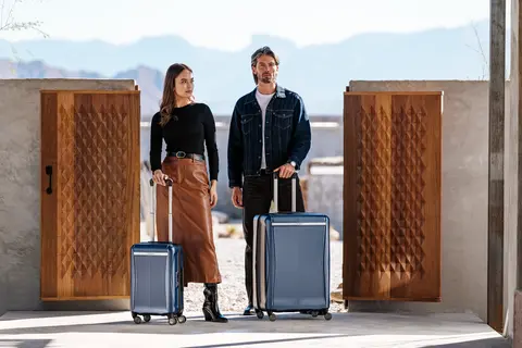 Luggage set wheeled side by side.