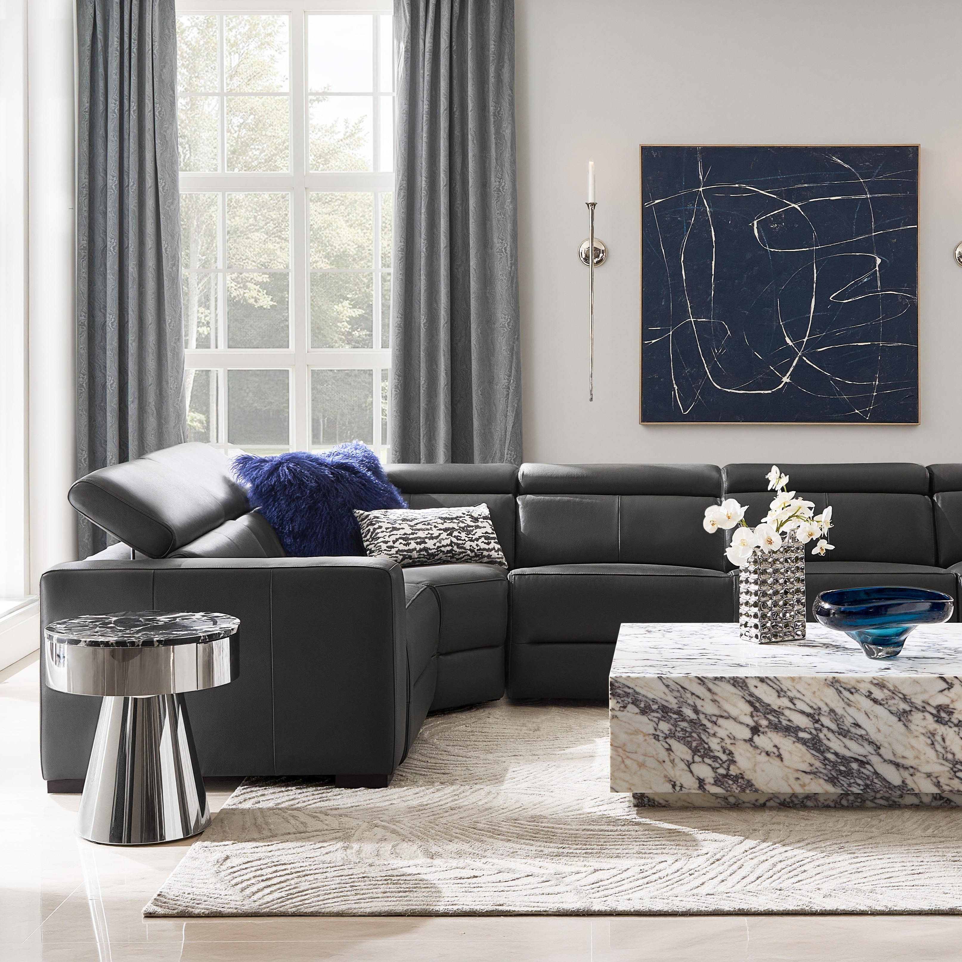 Gray leather reclining sectional with track arms and power recliners