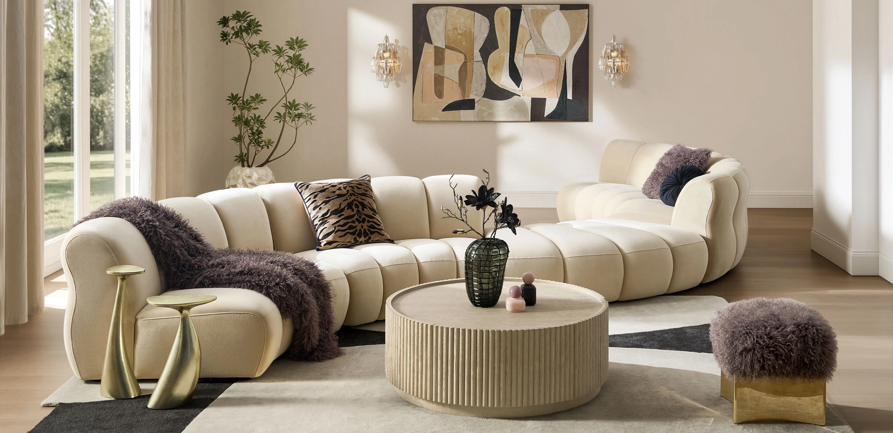  Cream modern channel-tufted curved sectional sofa paired with a fluted round coffee table and gold sculptural accents