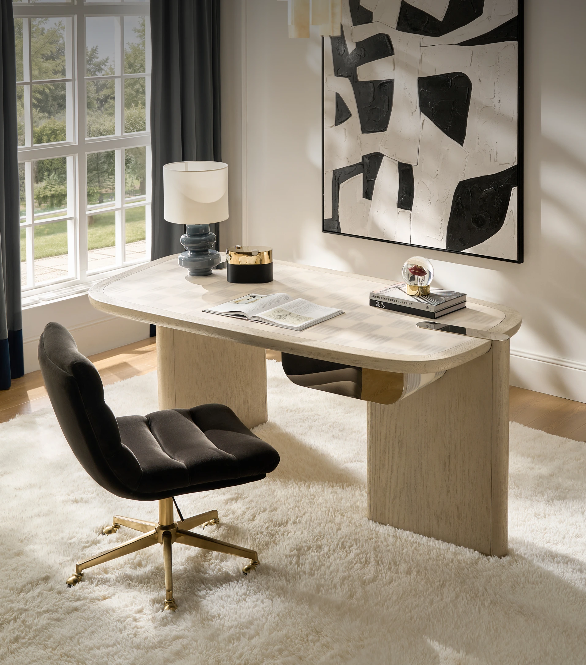 Contemporary modern study space with a minimalist curved desk, tufted black leather swivel desk chair, and plush high-pile rug by the window.