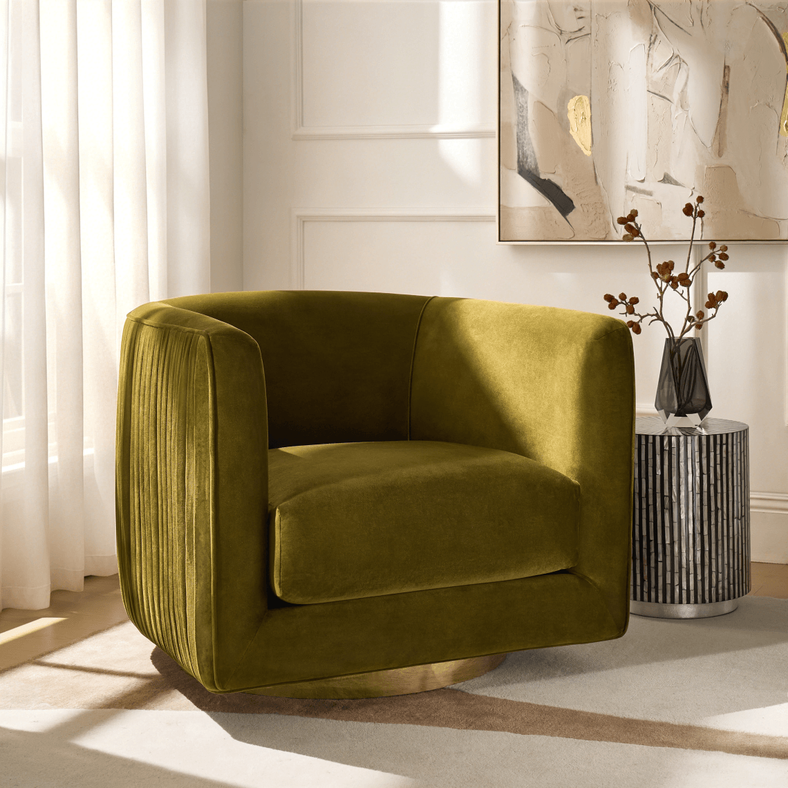 Olive green velvet barrel swivel chair with ribbed side stitching, positioned on a light neutral area rug near a window.