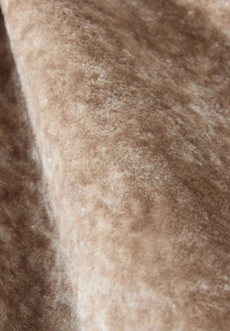Close-up view of warm taupe soft chenille upholstery fabric with inviting fuzzy texture.