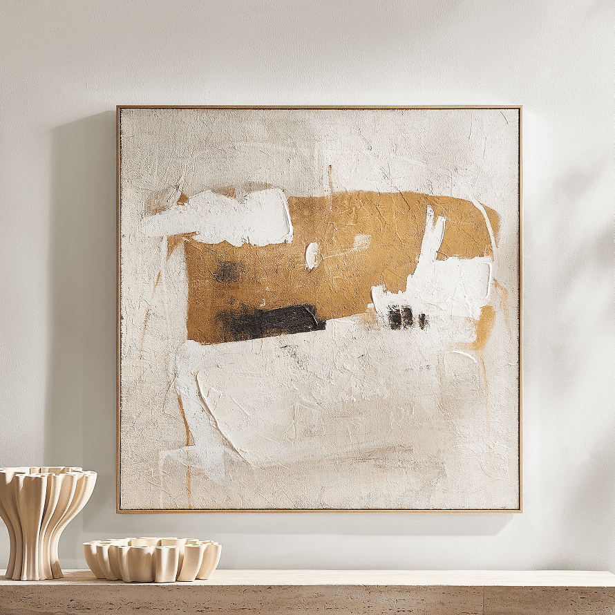 Framed large abstract canvas wall art featuring gold, white, and neutral textured brushstrokes on a wall above a console table