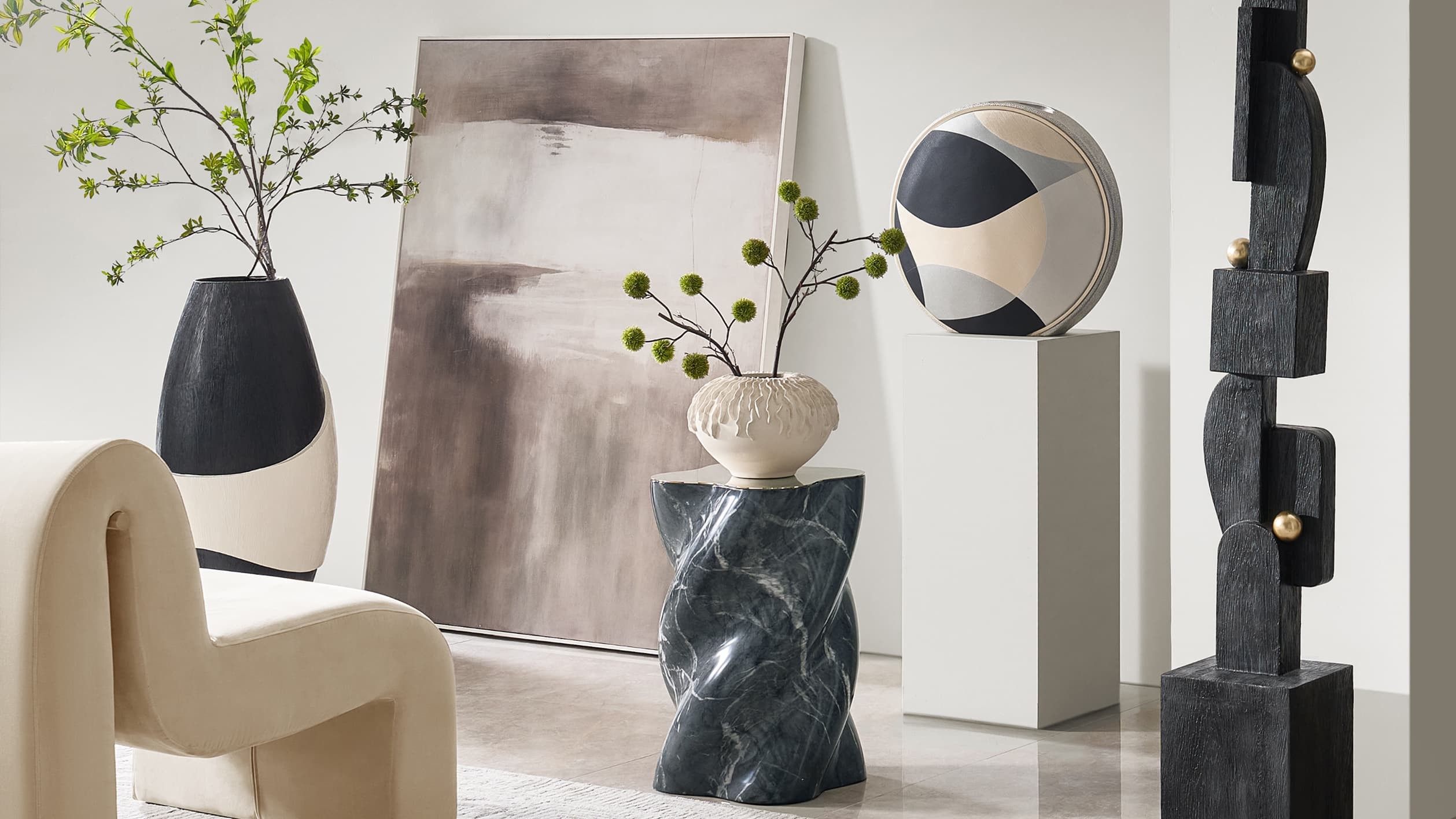 Stone, ceramic, painted canvas, and carved form come together in a composition that feels layered, deliberate, and gallery-calibrated.