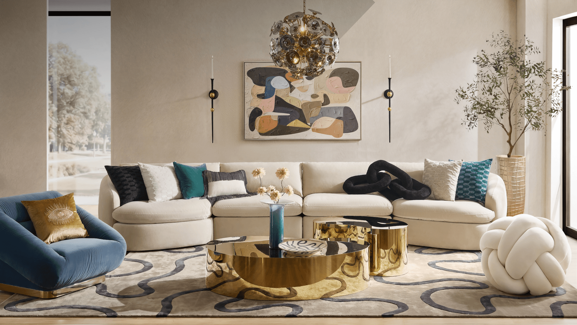 Modern elegant living room featuring a curved cream modular sectional sofa, blue accent swivel chair, reflective brass round coffee table, and an orb crystal chandelier.