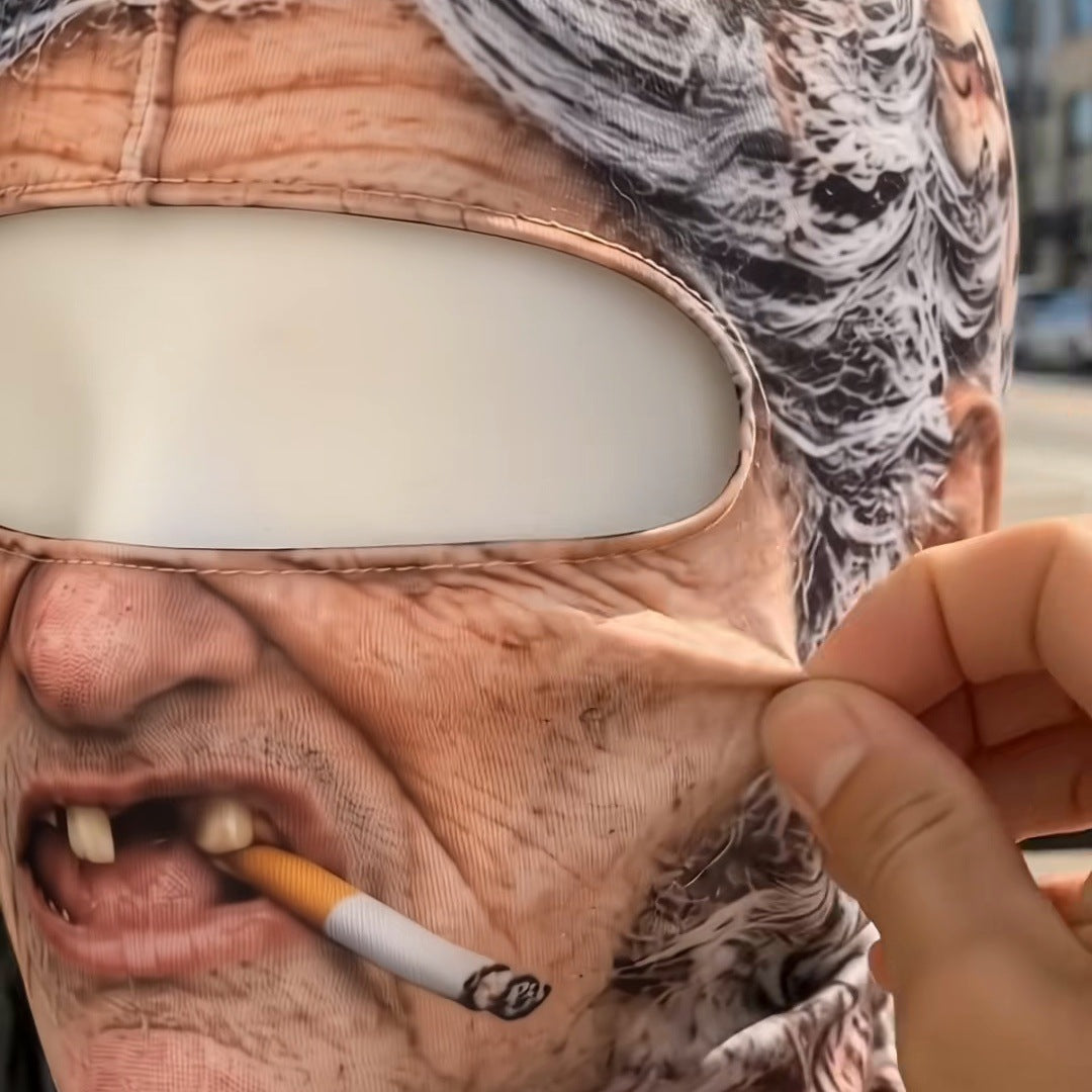 A close-up of the Grandma print, fingers pinching the printed cheek so the fabric stretches, eye panel and cigarette visible, no words