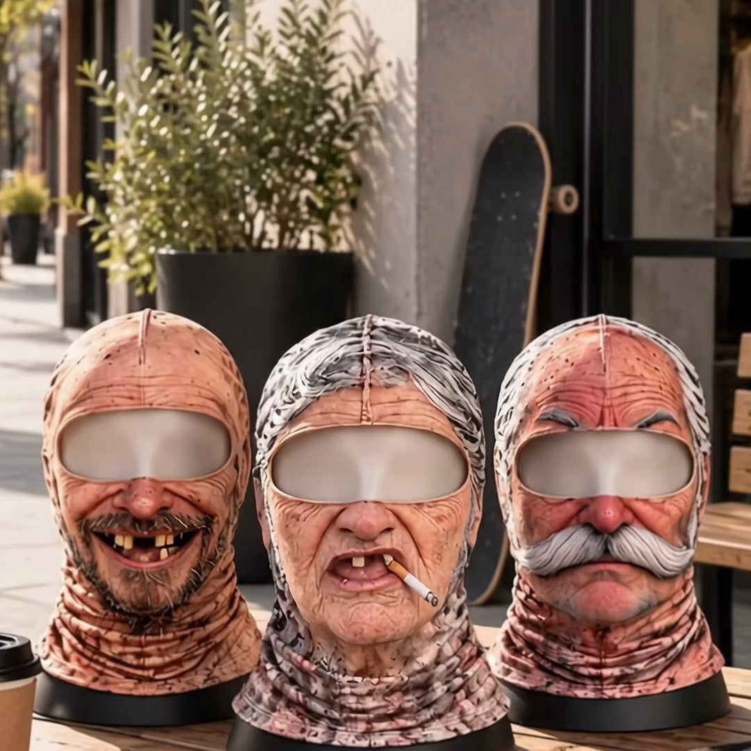 The three faces Uncle, Grandma and Grandpa on mannequin busts in a row on an outdoor table, each with the light-grey eye panel, no words