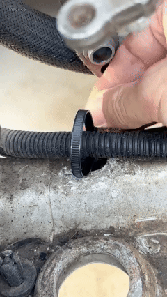 110-piece automotive push-mount cable tie kit in use