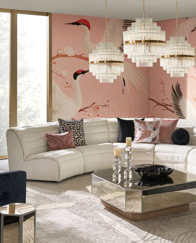 Modern living room with pink crane wallpaper and elegant furnishings.