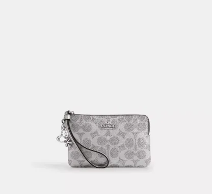 Boxed Corner Zip Wristlet In Signature Canvas With Charms