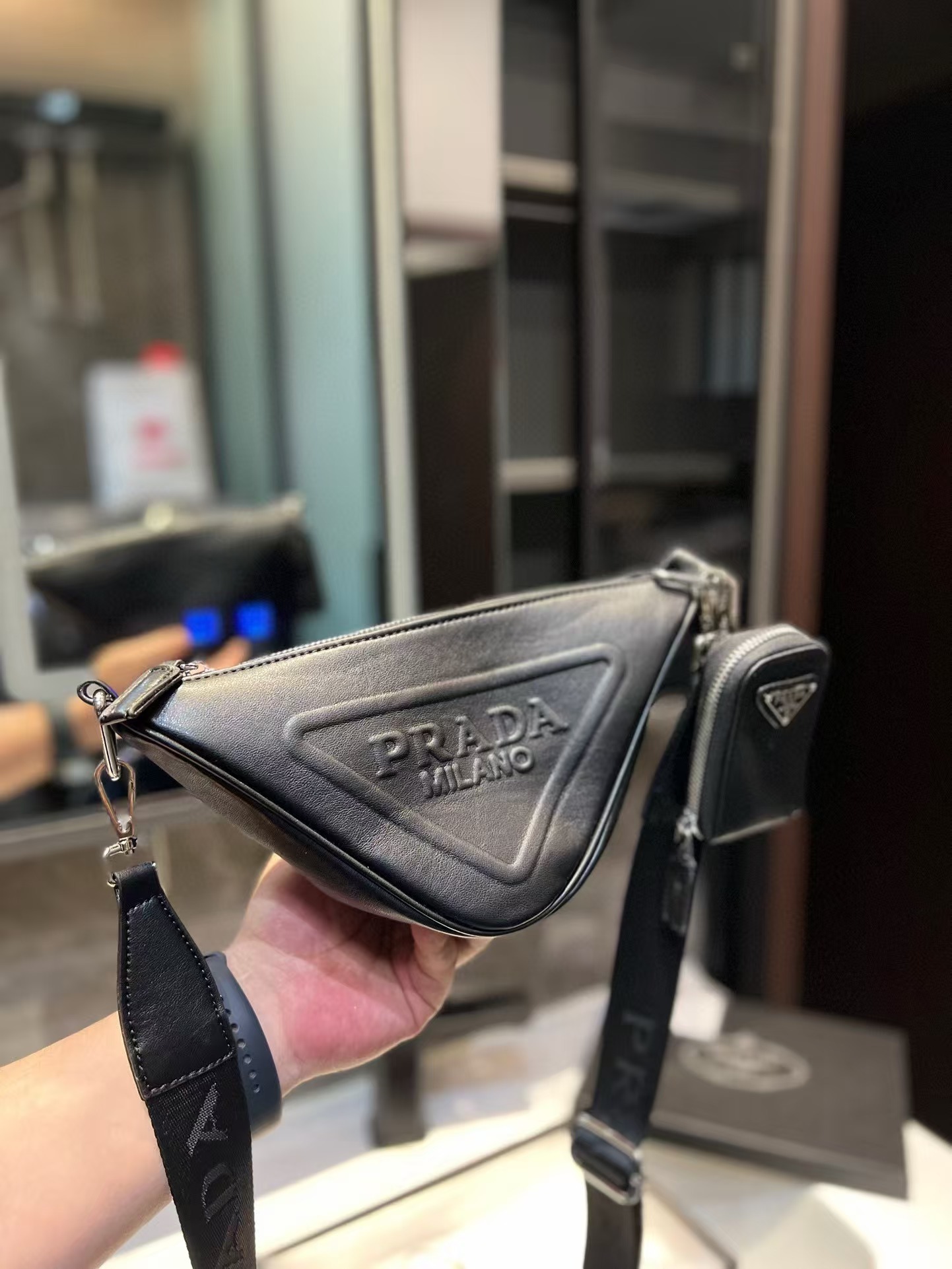 Triangle leather mini-bag