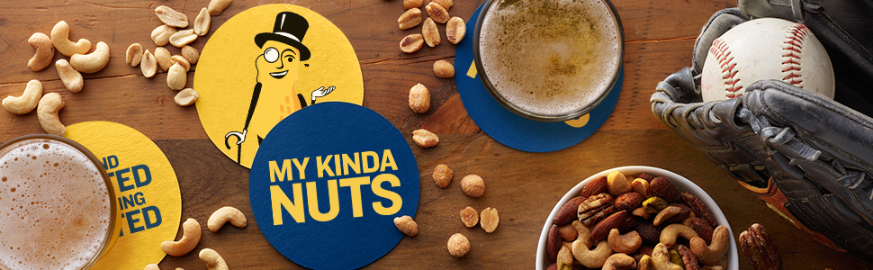 Mixed nuts on wood table with Planters&amp;#39; coasters, beer, and baseball glove