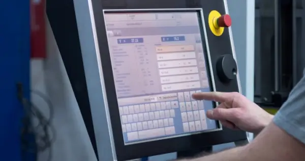 {"default":"Omron HMI panel providing operators with real-time monitoring and control"}
