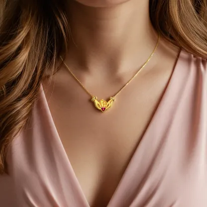 Custom Heart Shape Birthstone Name Necklace featuring Parents' Hands Cradling Baby Feet