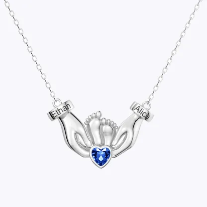 Custom Heart Shape Birthstone Name Necklace featuring Parents' Hands Cradling Baby Feet