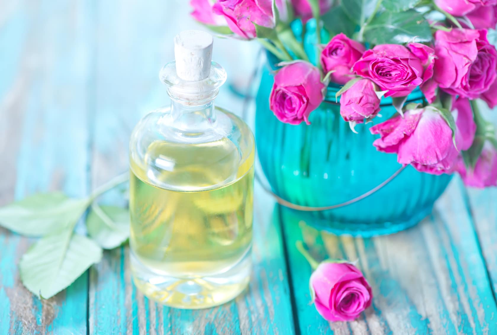 rose oil in glass bottle