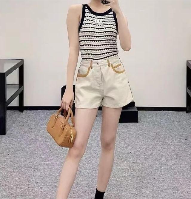 MIU25SS wrap-around patchwork denim shorts