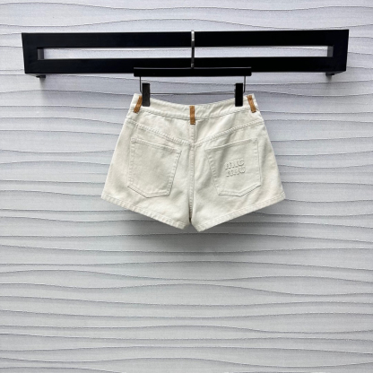 MIU25SS wrap-around patchwork denim shorts