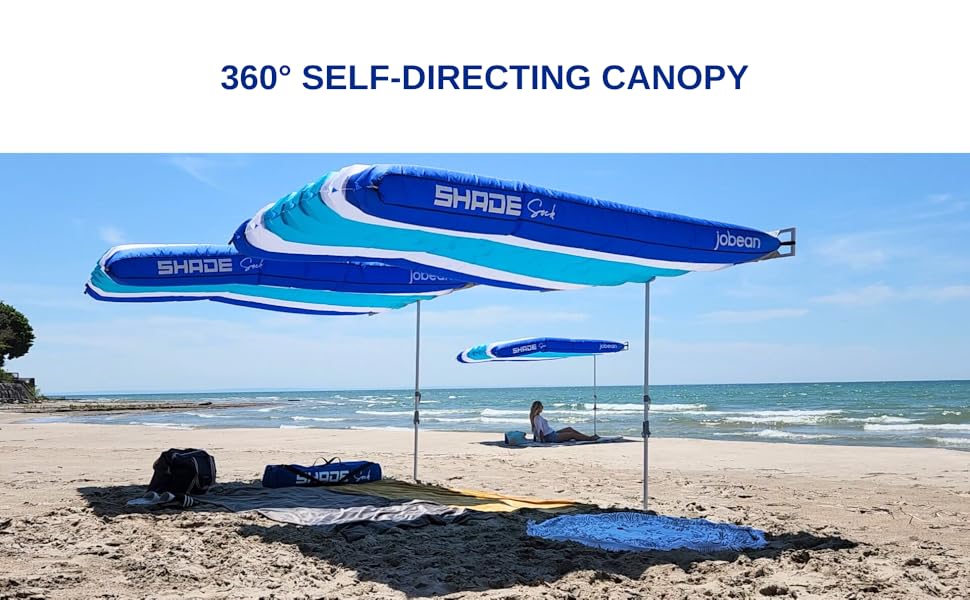 multiple ShadSock beach shades flying on the beach