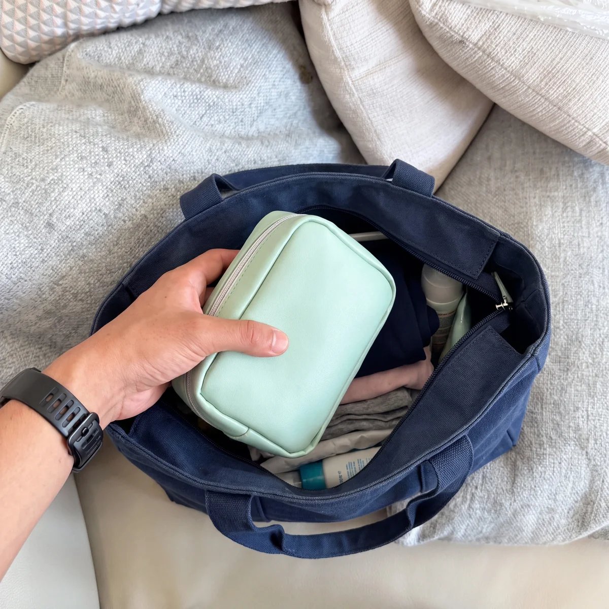 Compact pill organizer pouch styled like an everyday accessory bag