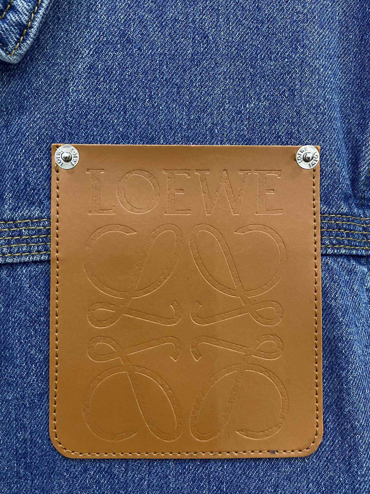 LOE25SS leather embossed logo denim jacket