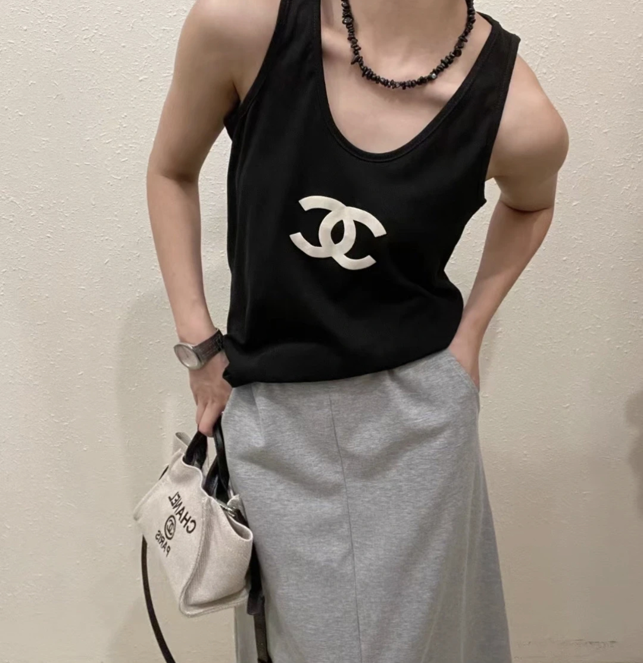 CHAN Logo vest on the chest