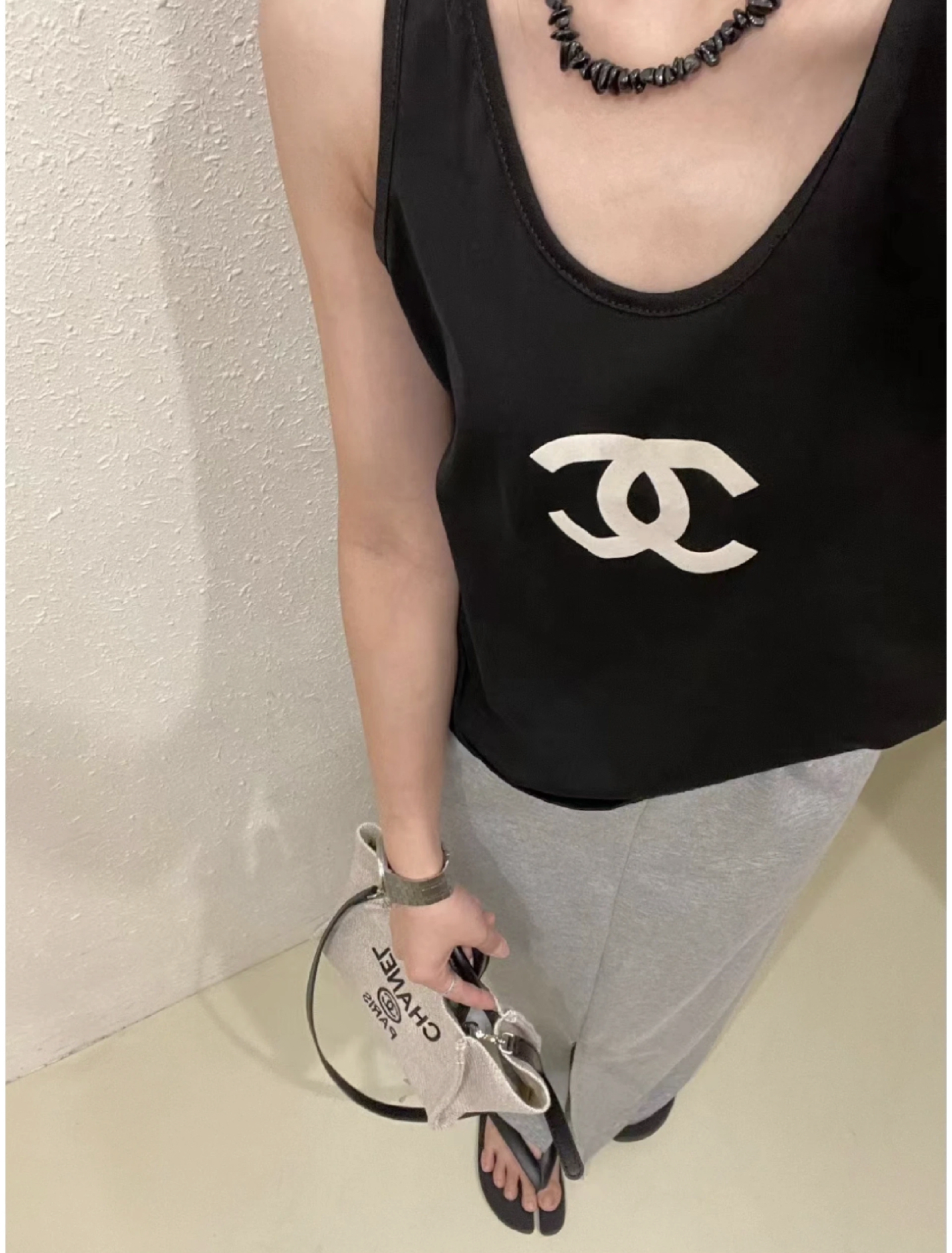 CHAN Logo vest on the chest