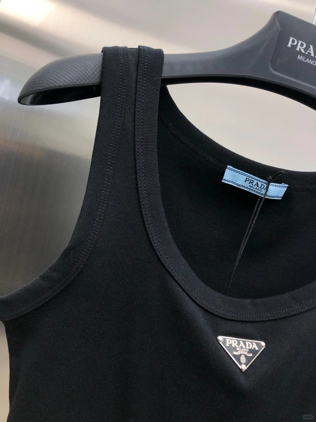 PRAD Triangle Label Crew Neck Peplum Vest