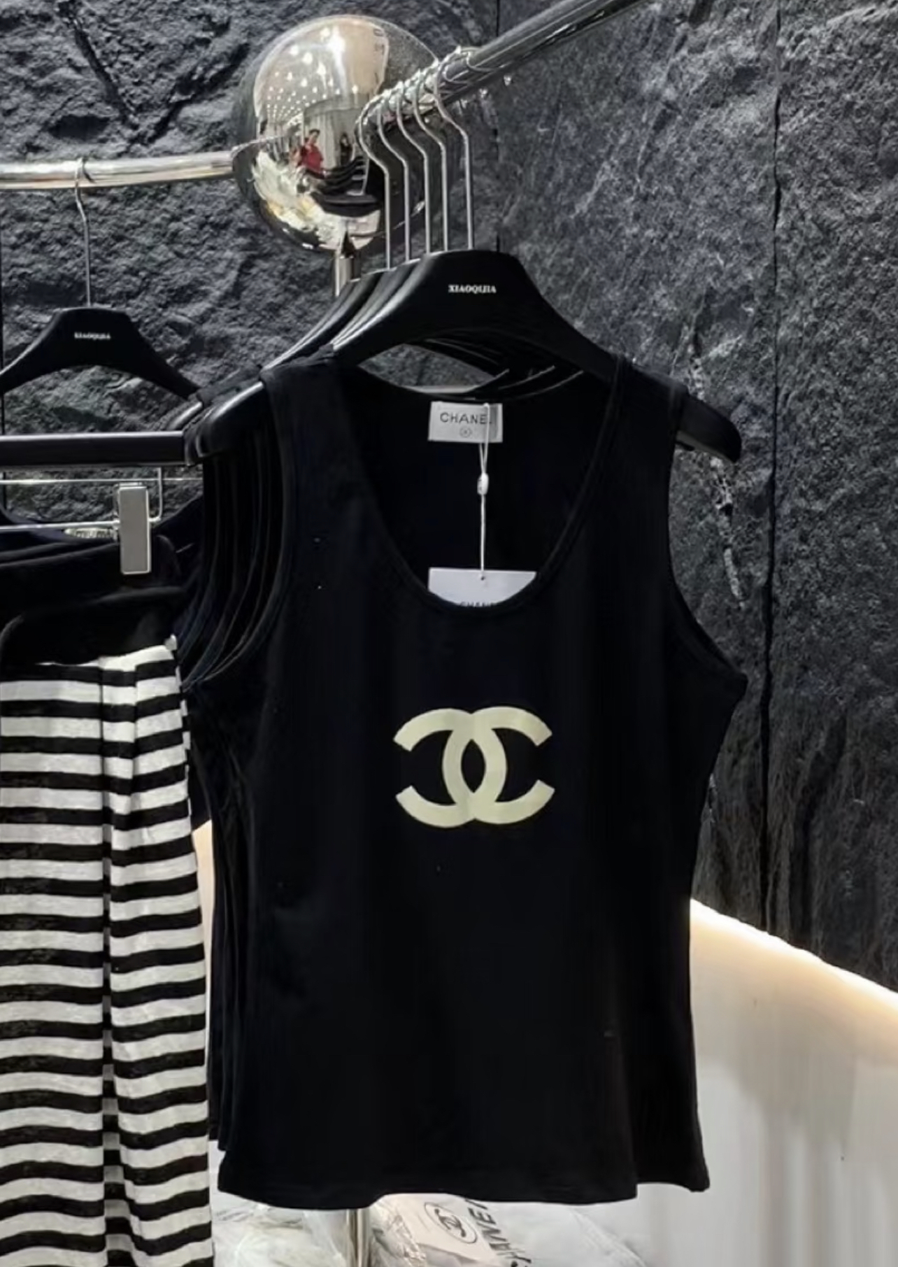 CHAN Logo vest on the chest