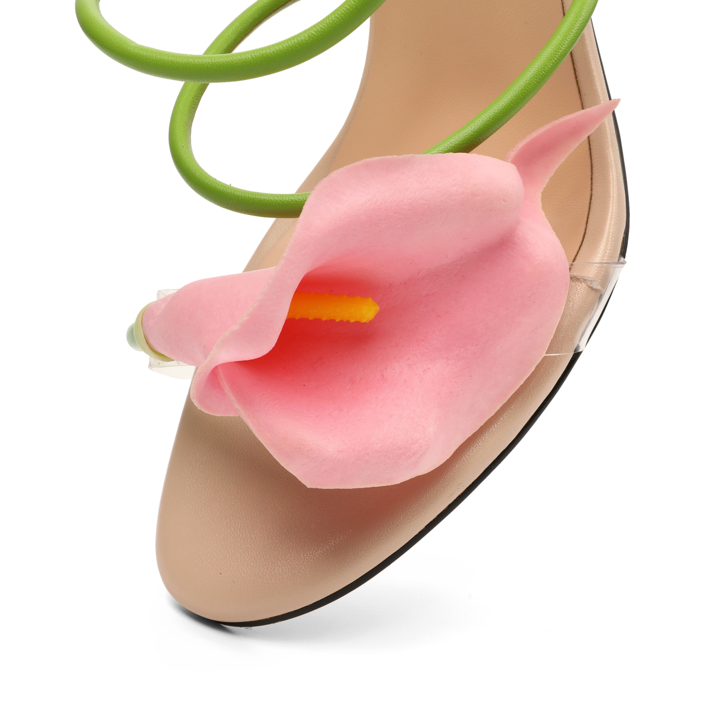Top angle showing pink 3D floral detail and intertwined green straps on stylish high heel sandals