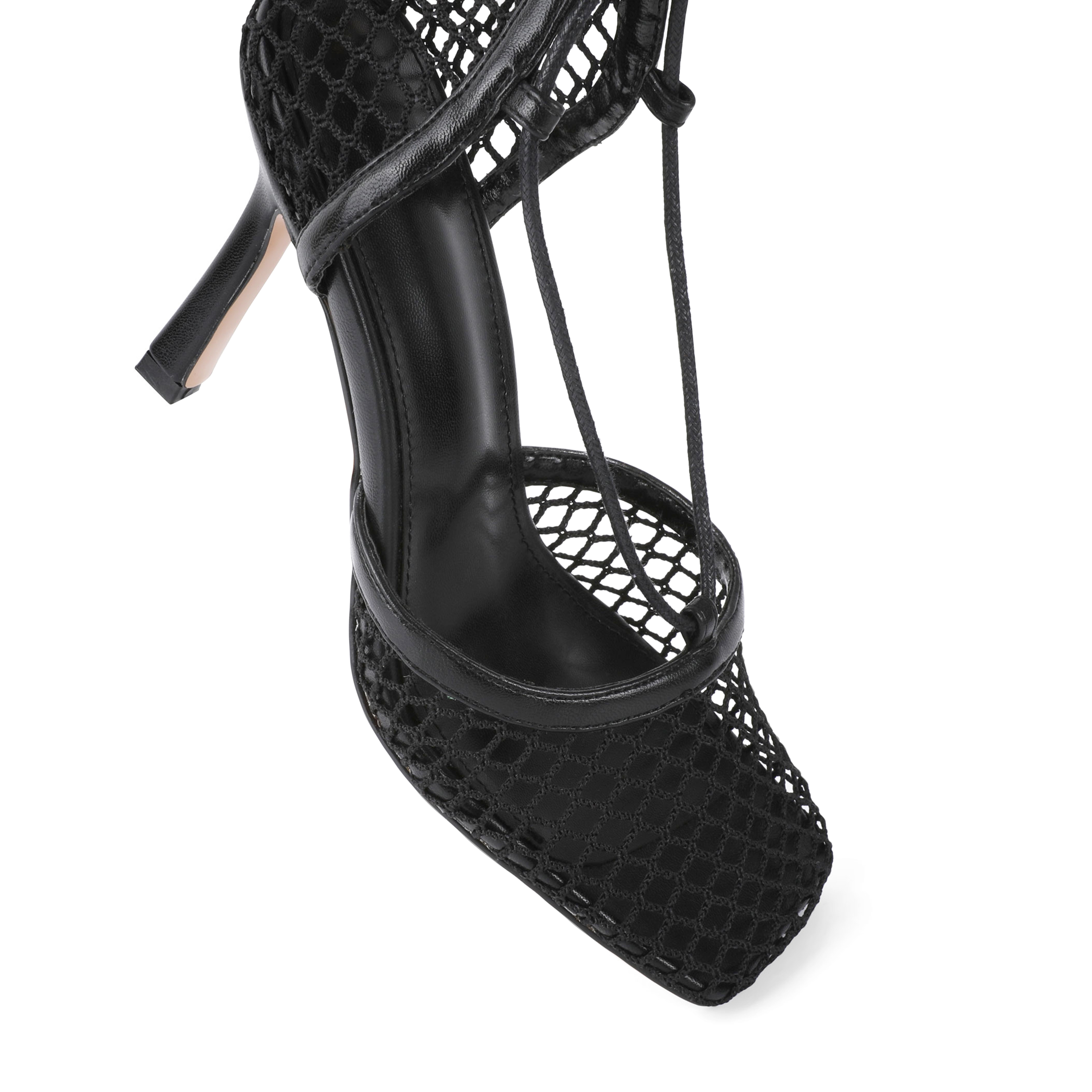 Close-up of stiletto heel and wrap-around lace-up straps