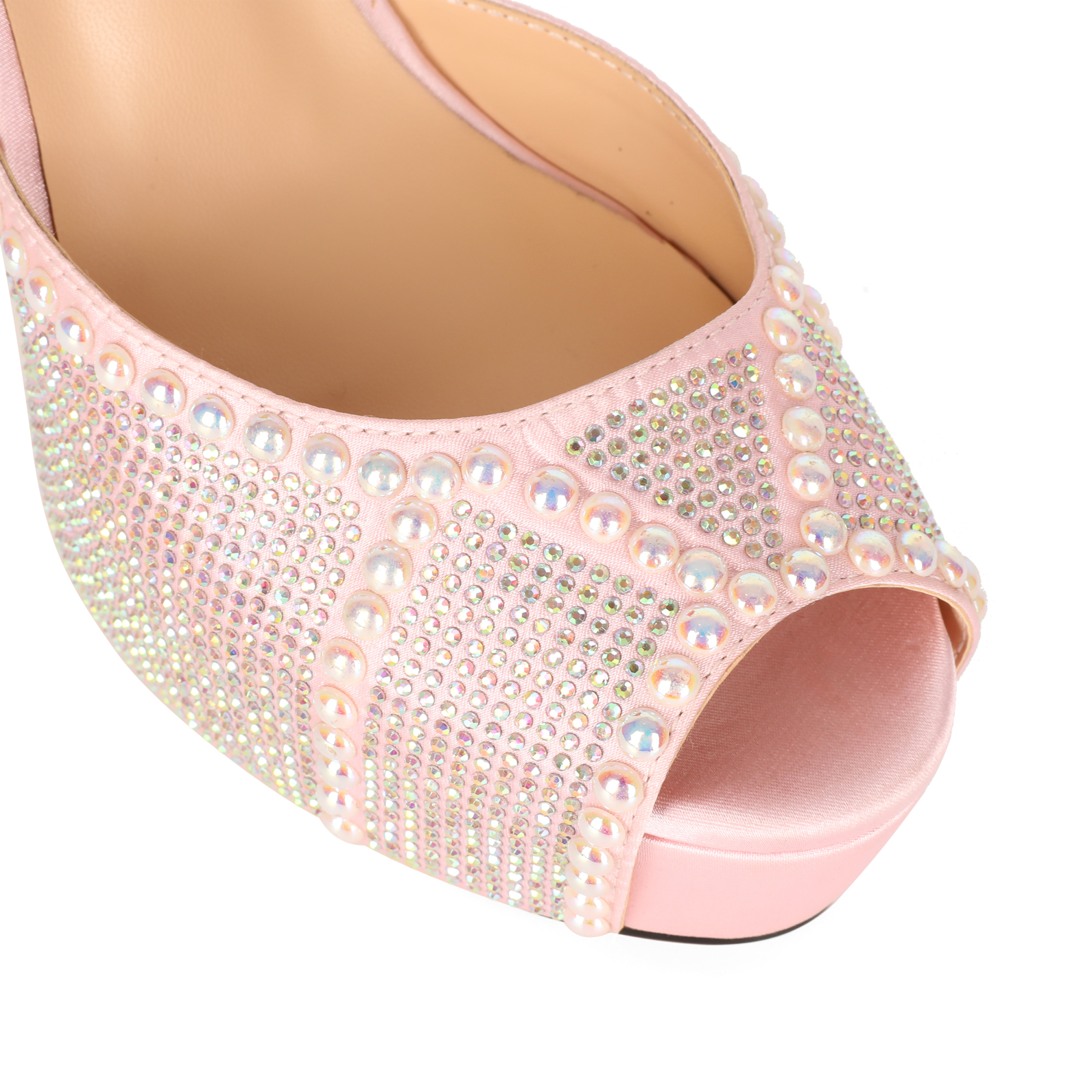 Macro shot of the rhinestone clusters on satin fabric, showing texture and shine