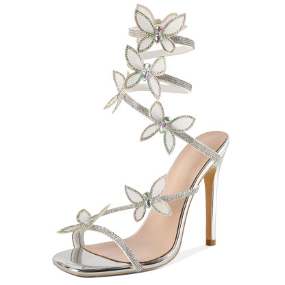 Silver open toe high heel sandals with rhinestone butterfly detail