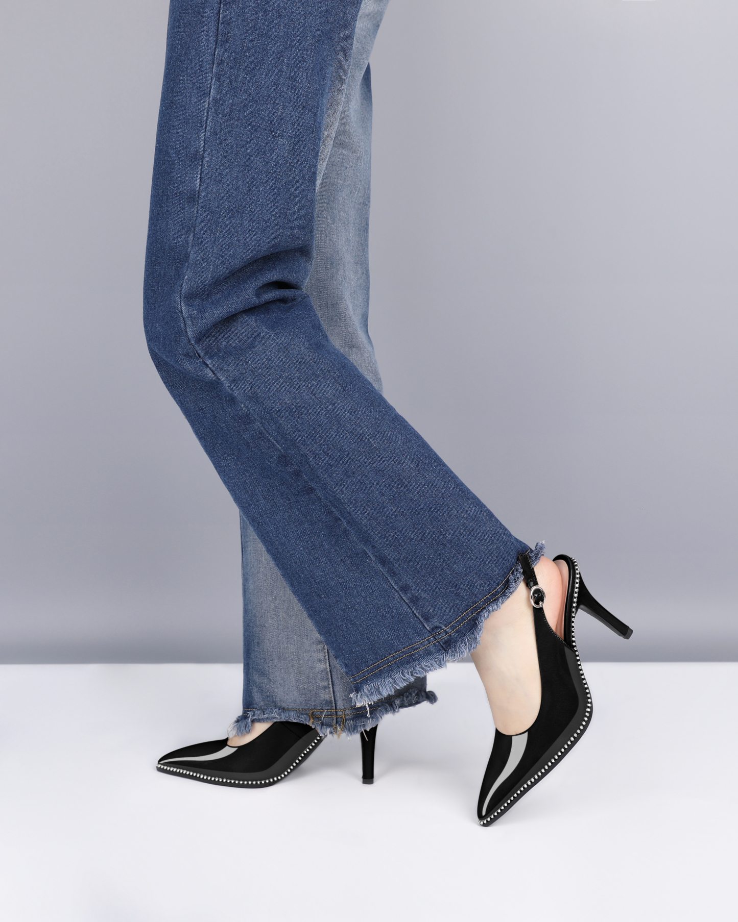 Model wearing black SAMMITOP 3.5" slingback heels with silver beading, side view