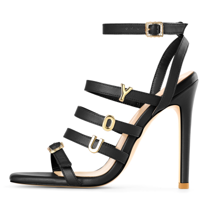 Side profile of strappy stiletto heels showing ankle strap and slim silhouette