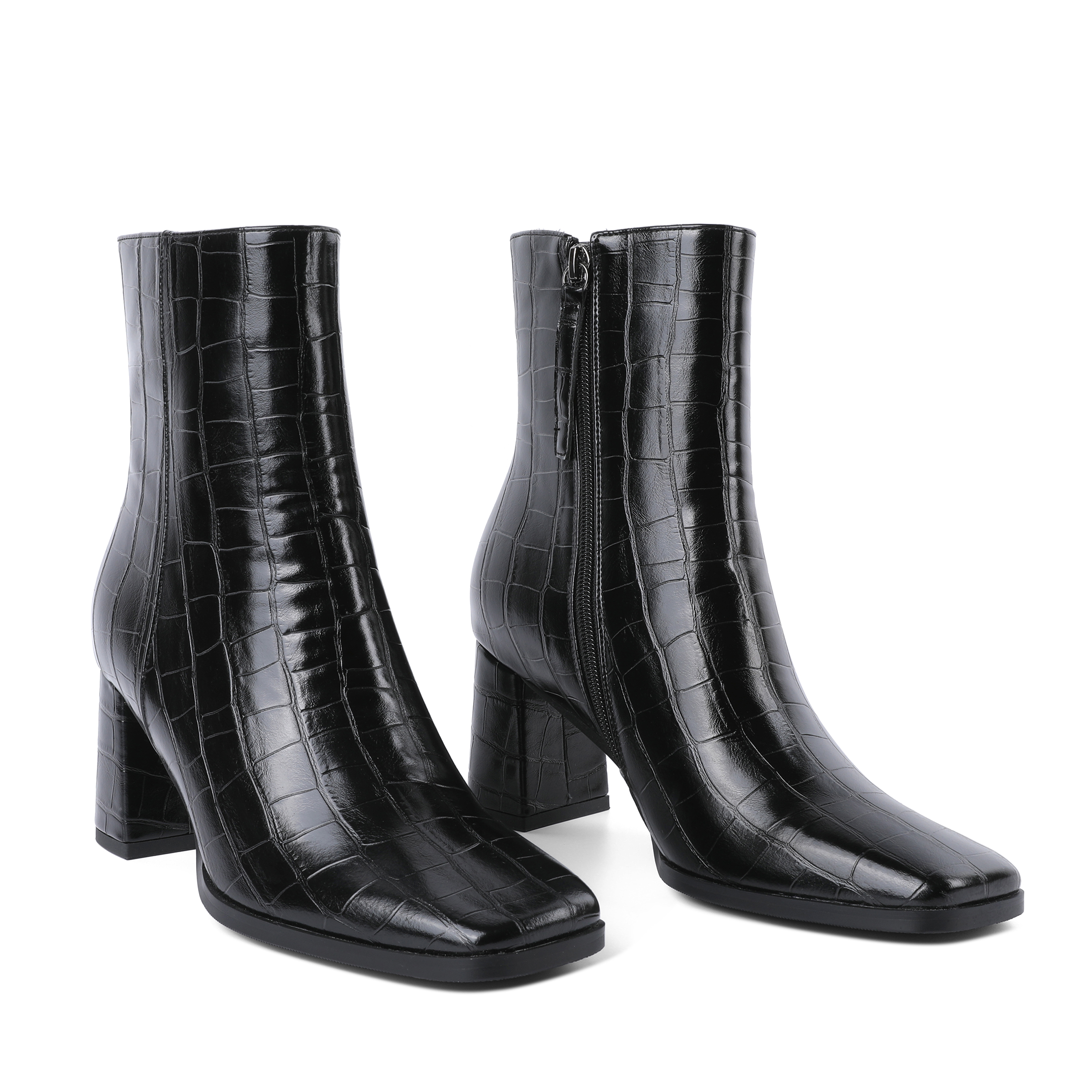 Side view showing croc pattern and 3 inch chunky heel with zipper
