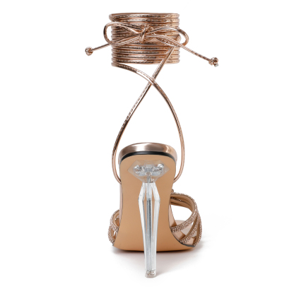 Back view of gold stiletto heels with ankle wrap