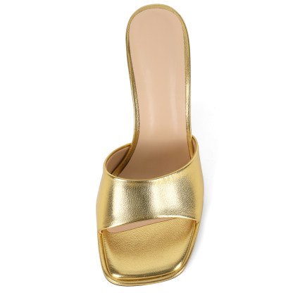 Gold heeled sandals close-up top view