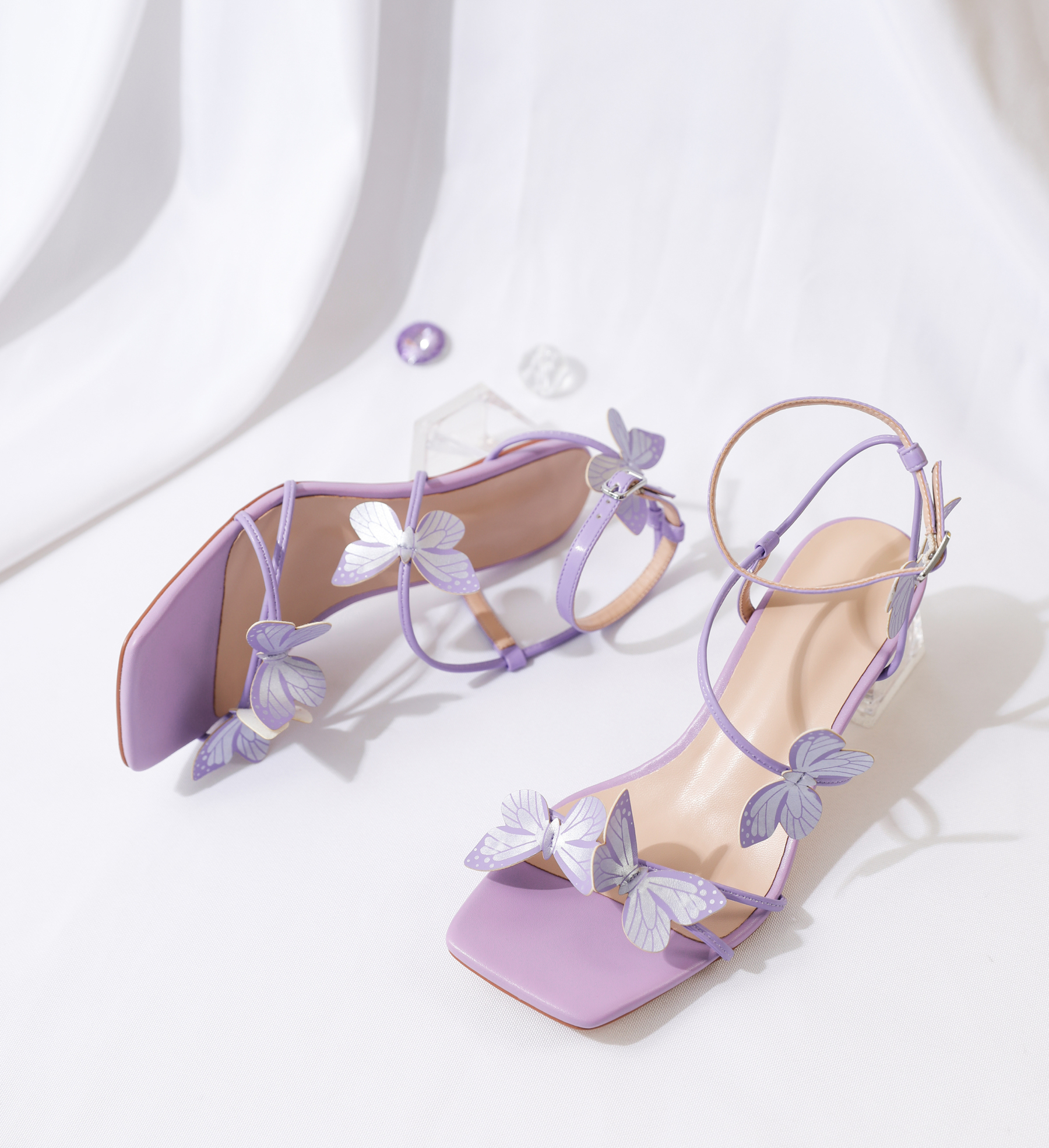 Close-up of butterfly lace-up strap in soft purple finish